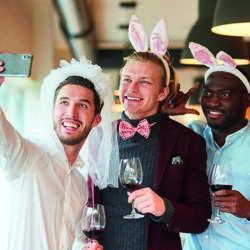 Friends make selfie at bachelor party in a bar as a reminder